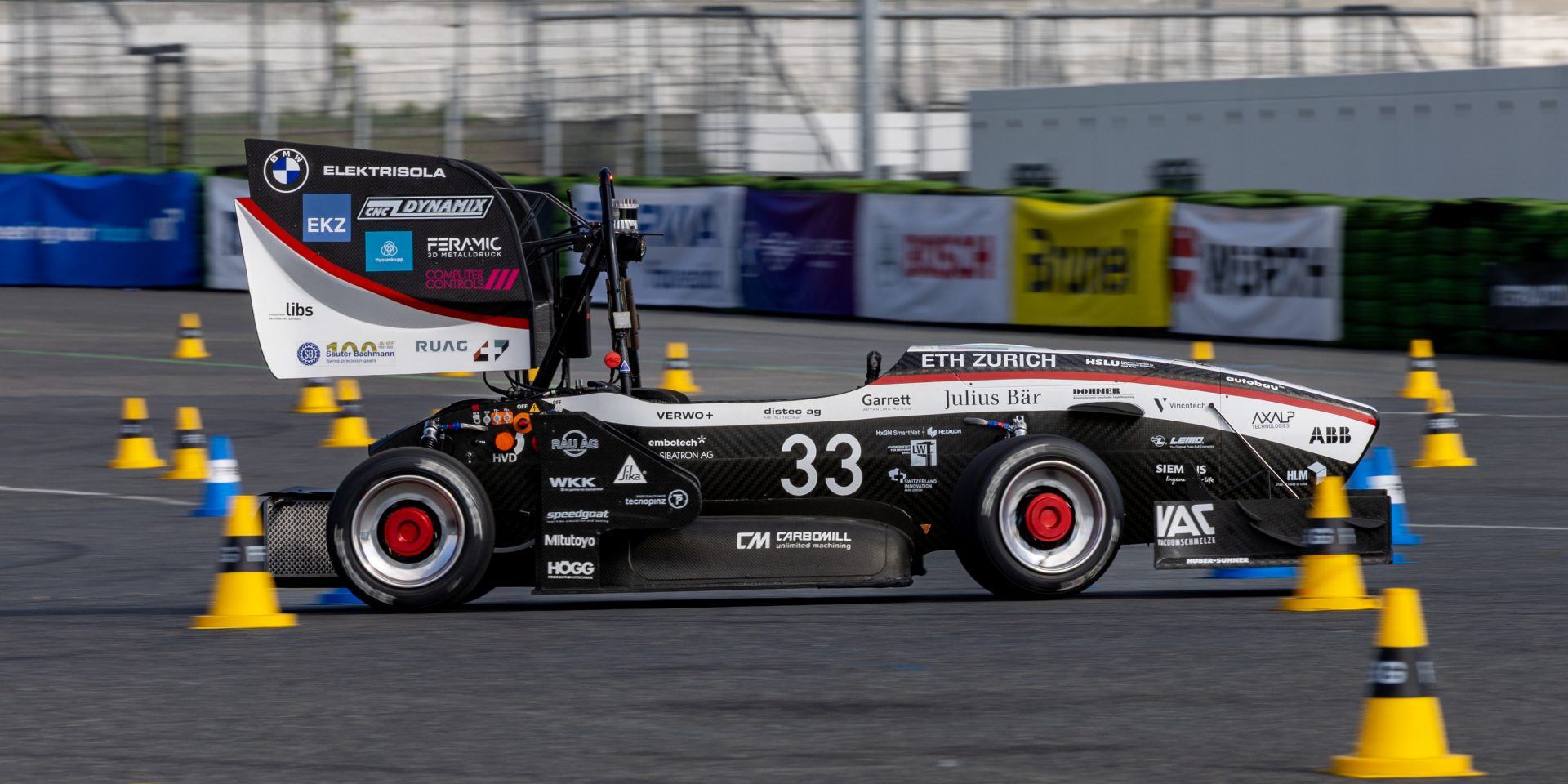Racecar driving on a Test track.