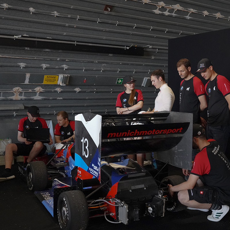 A huge team is checking the car.