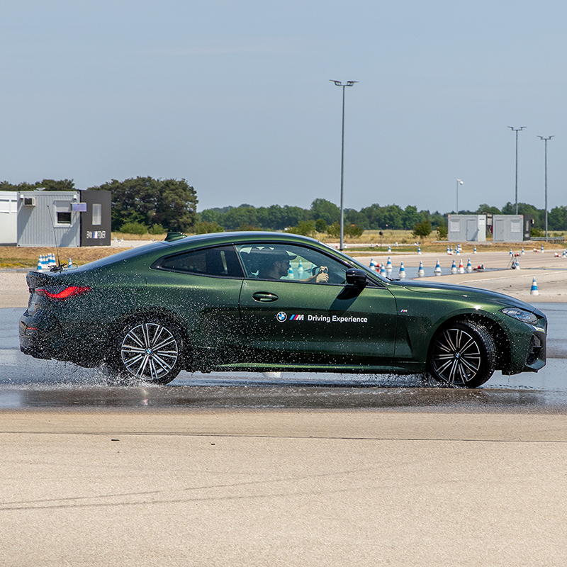BMW Driving experience. Car drifting on a wet space.