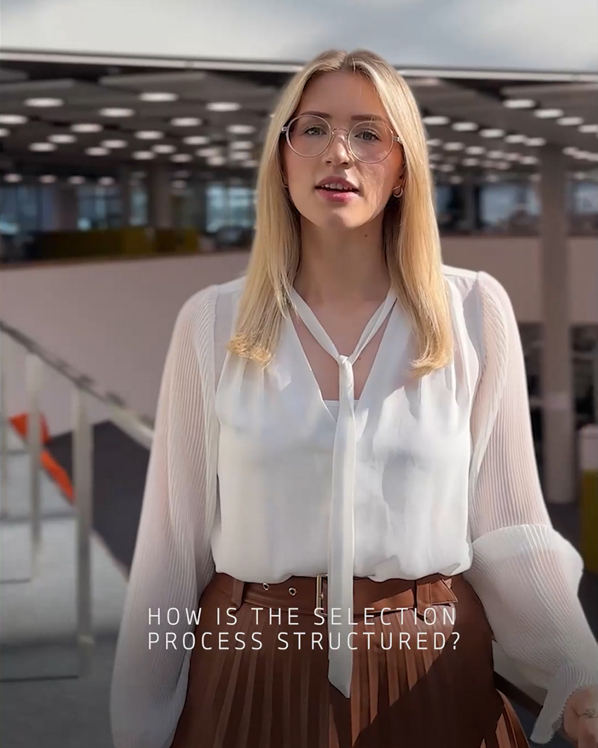 A female trainee answering the question "How is the selection process structured?"