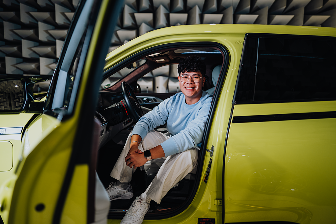 AcceleratiON trainee Yian in the driver's seat of the BMW XM.