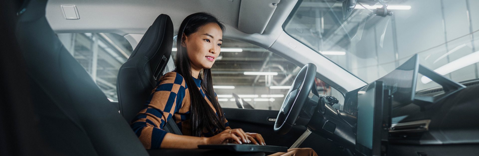 This picture shows a BMW Car IT specialist at work.