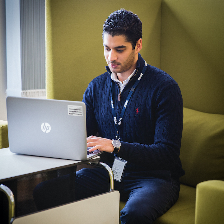 A young man focused on his work.