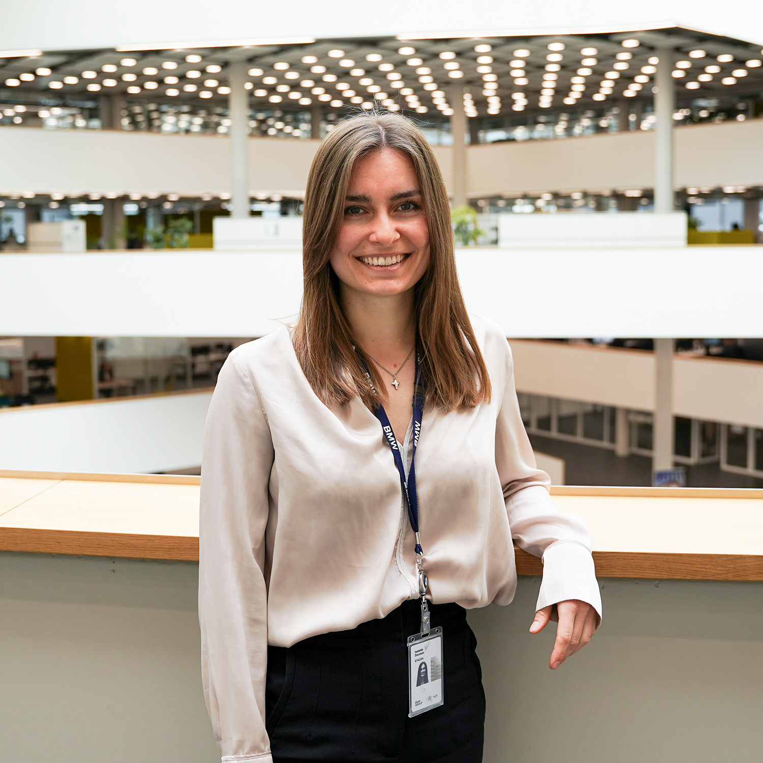 A young female thesis award finalist smiling at the camera.