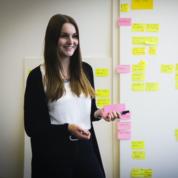 A female working student presenting something.
