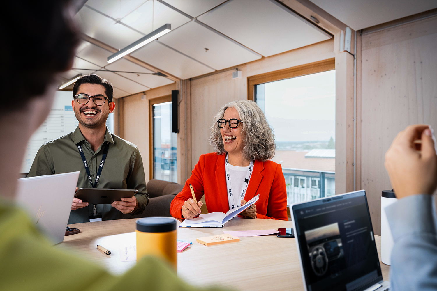 A recruiter is giving application tips to two candidates