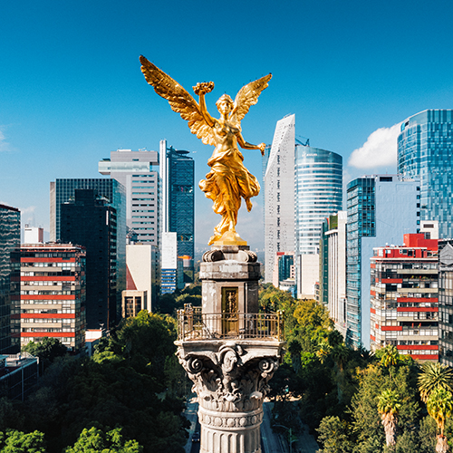 The picture shows the Basilica of Our Lady of Guadalupe in Mexico City and the surrounding city.