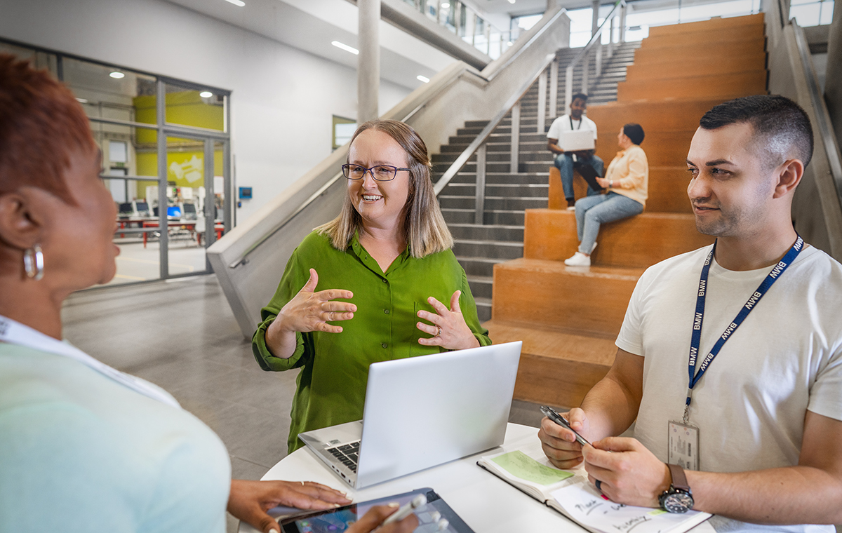 Two BMW employees are interviewing an applicant.