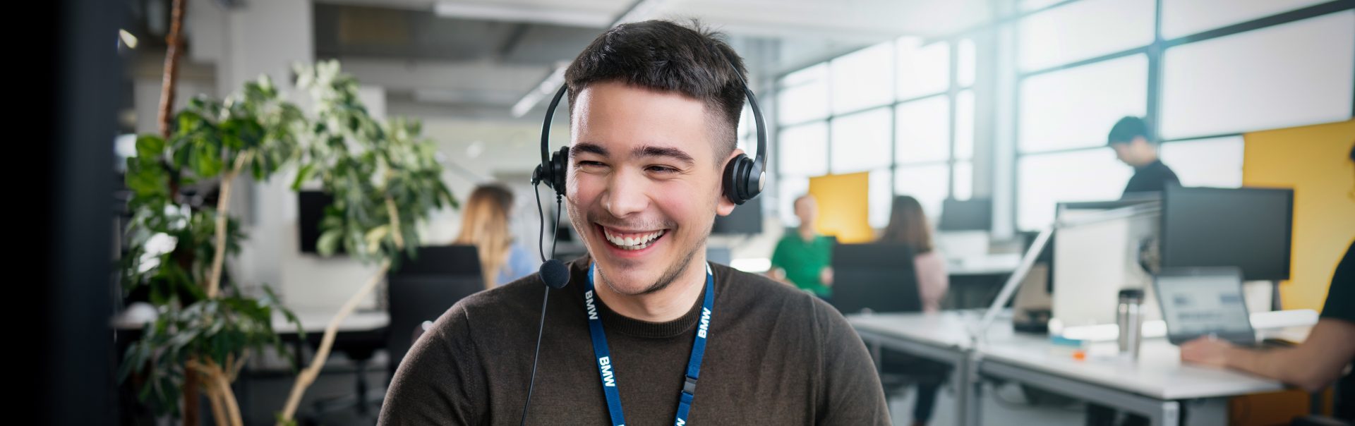 A customer services employee is talking to a customer via phone.