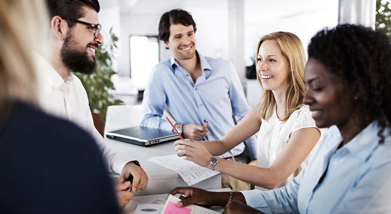 Five BMW professionals are having a meeting.