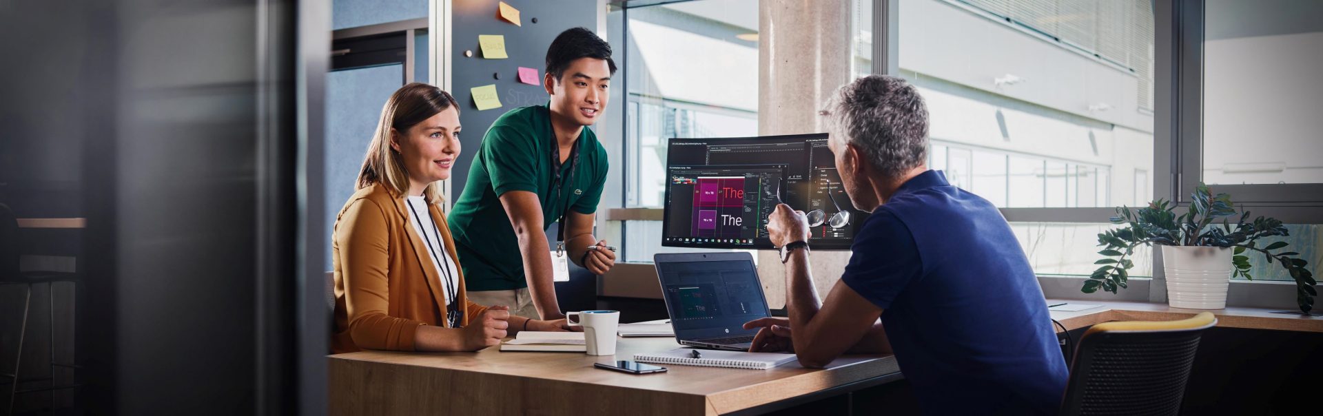 Two people in a dealership are talking to each other.