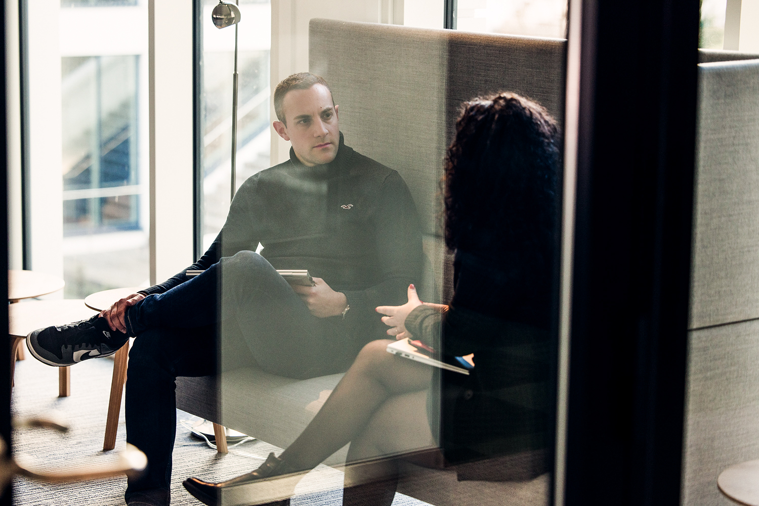 Three colleagues in a meeting.