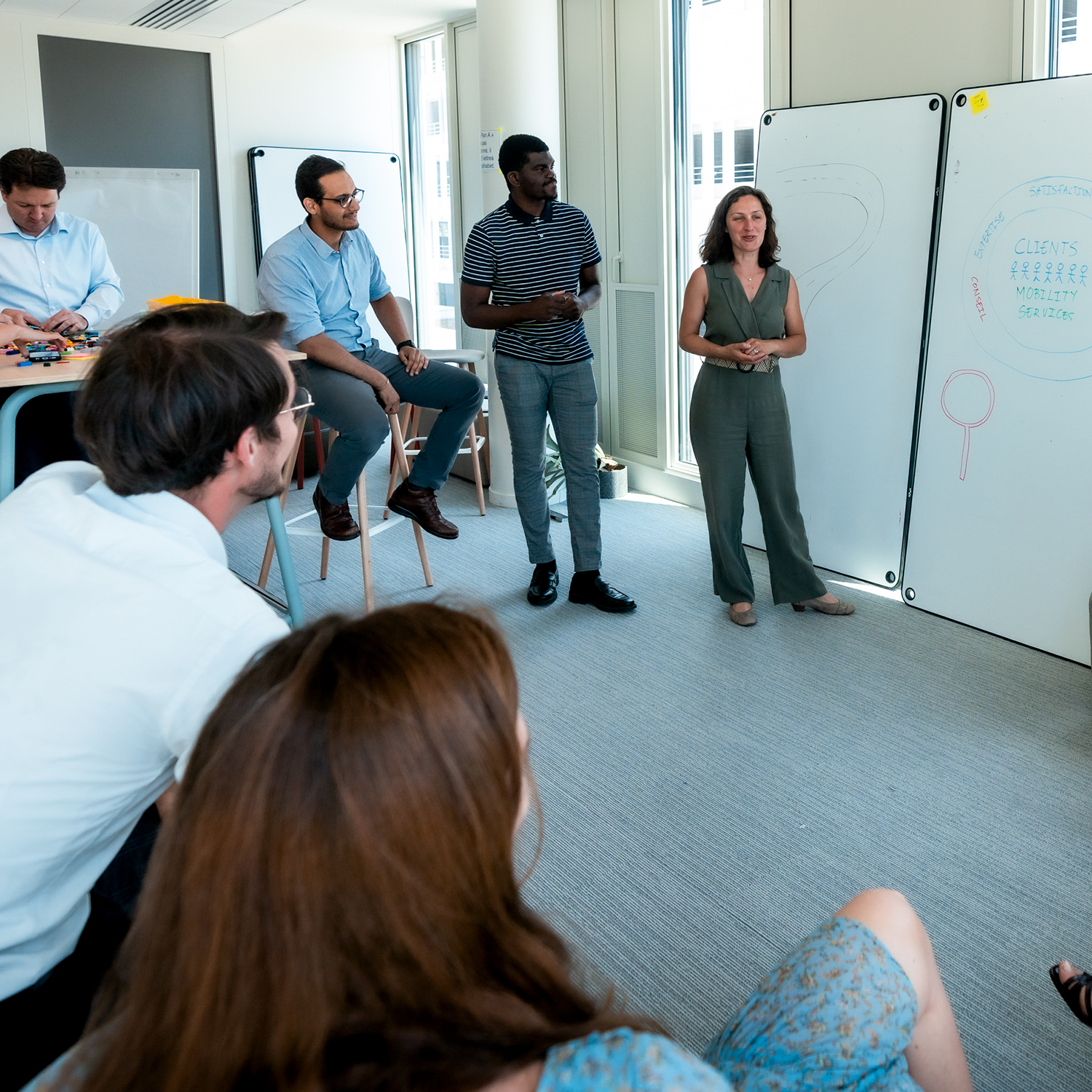 An employee conducts a training session for other colleagues.