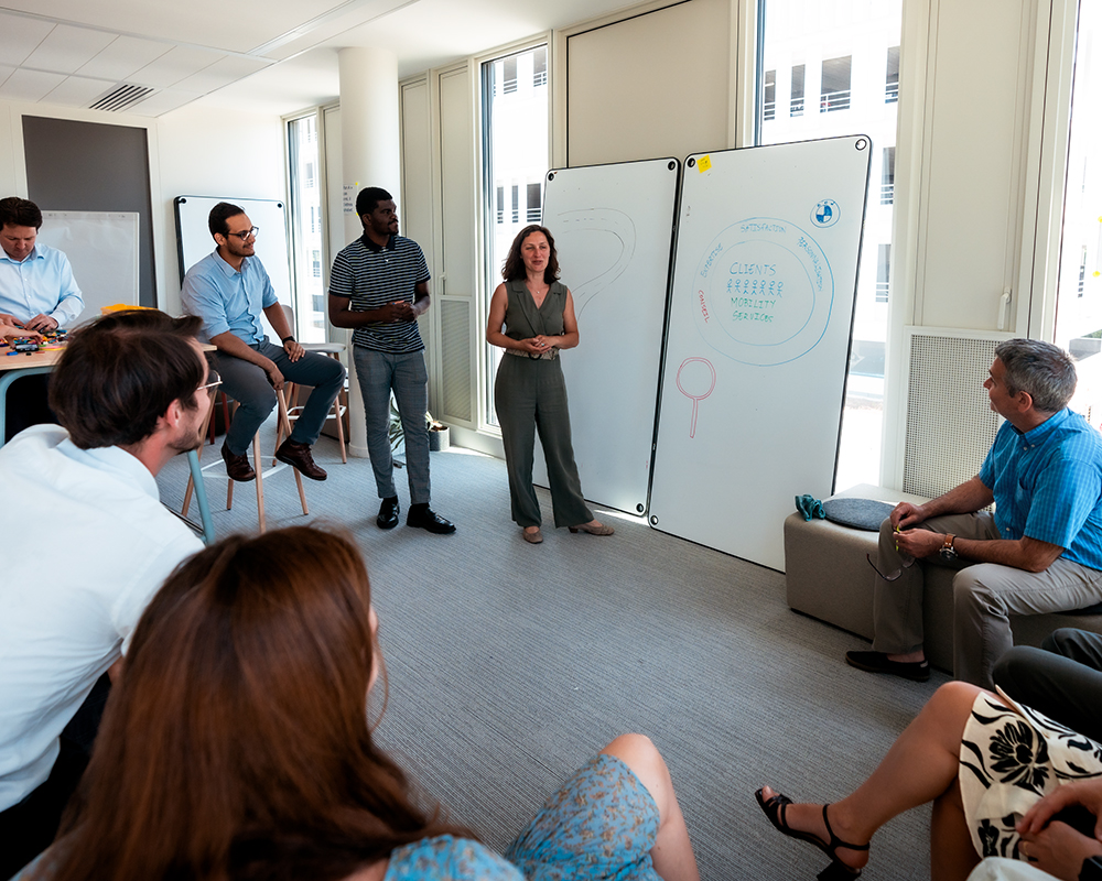 An employee conducts a training session for other colleagues.
