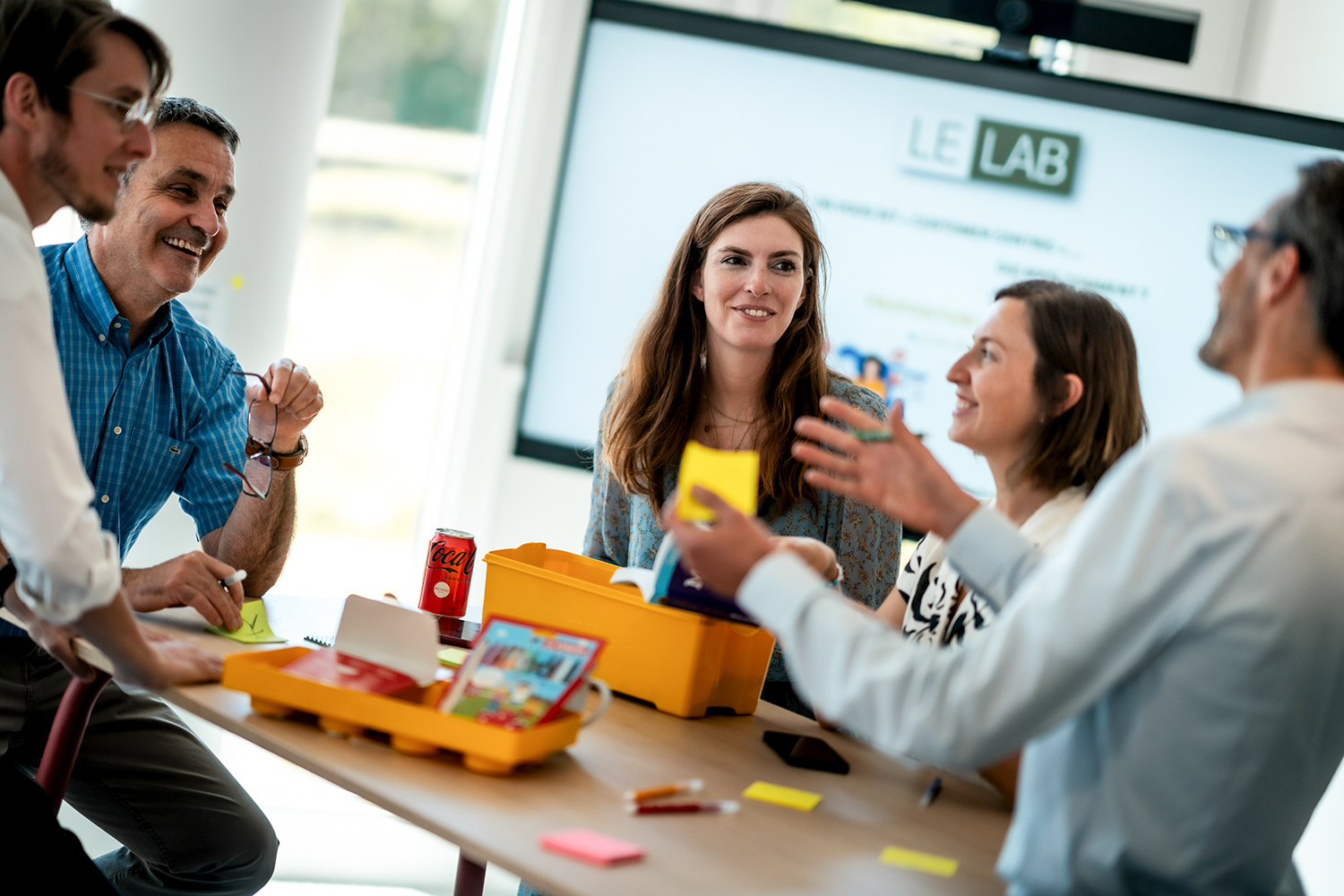 A group of employees working in data analytics, having a meeting