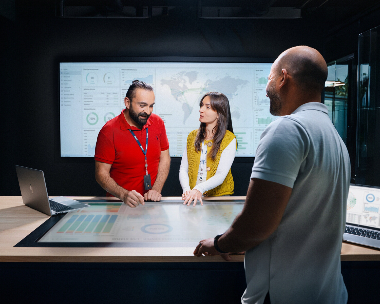 Three colleagues brainstorming in a modern office environment