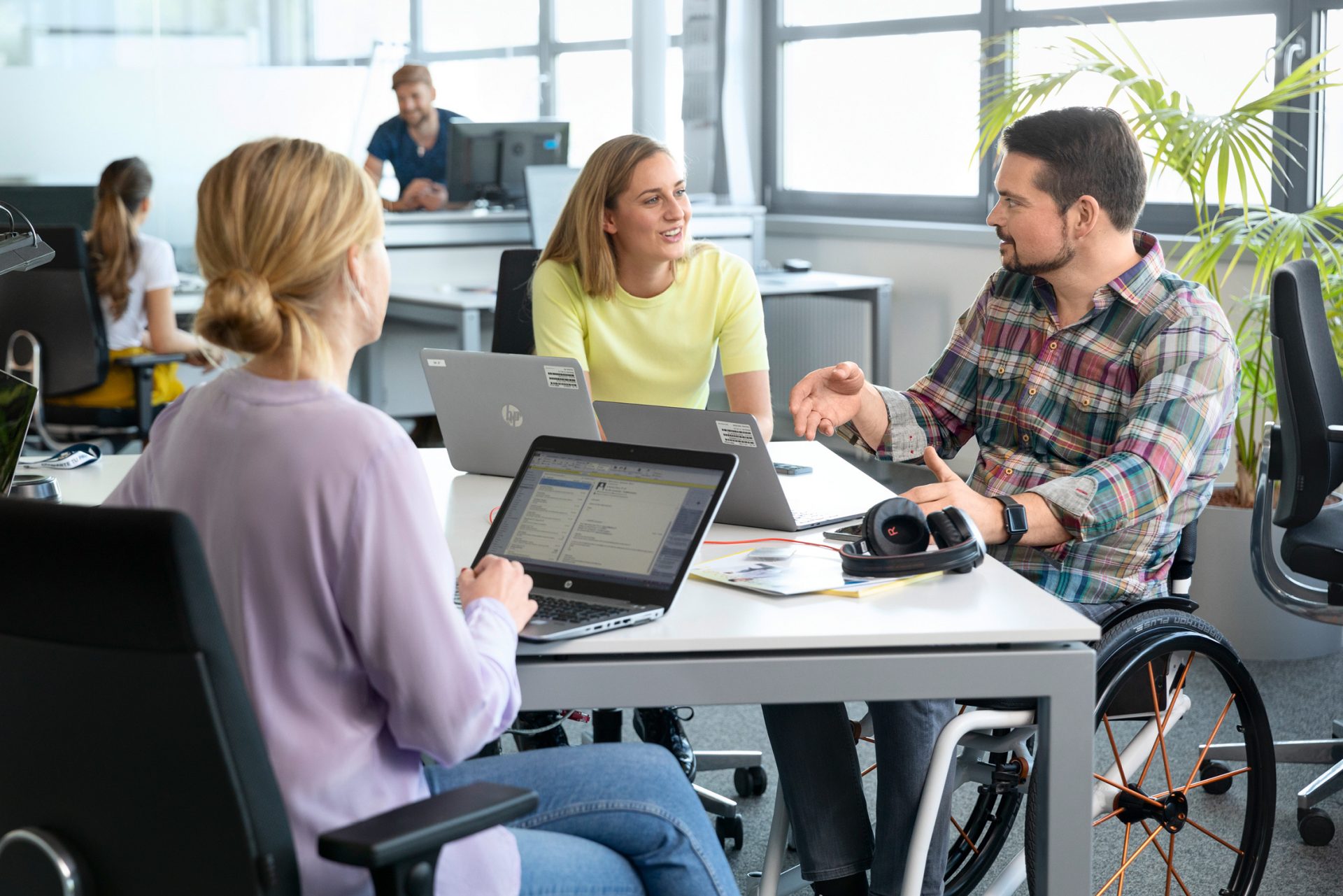 This picture shows diverse people in a group meeting.