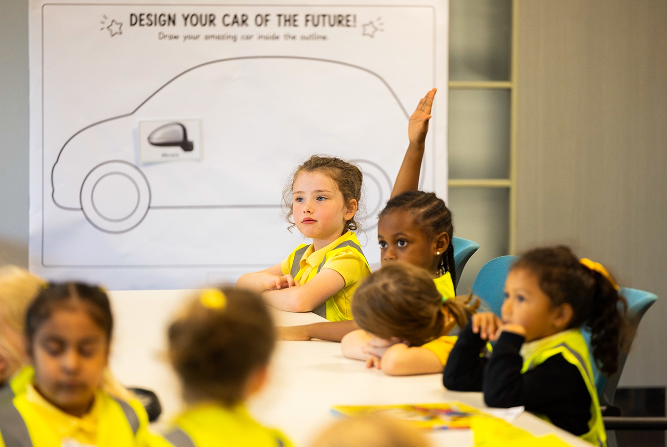 School students participating in a classroom session about vehicle design and mobility.