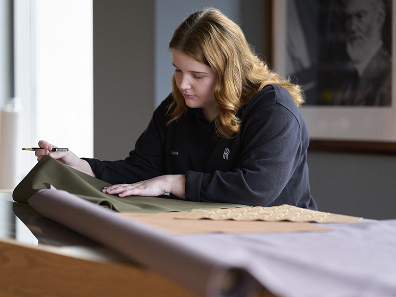 A young craft apprentice working at Rolls-Royce Motor Cars