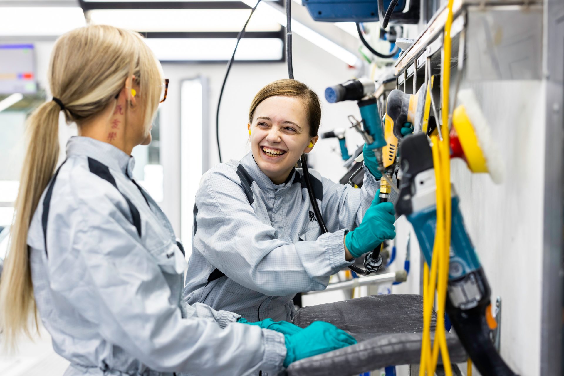 Lauren, BMW Group apprentice standing in front of a window