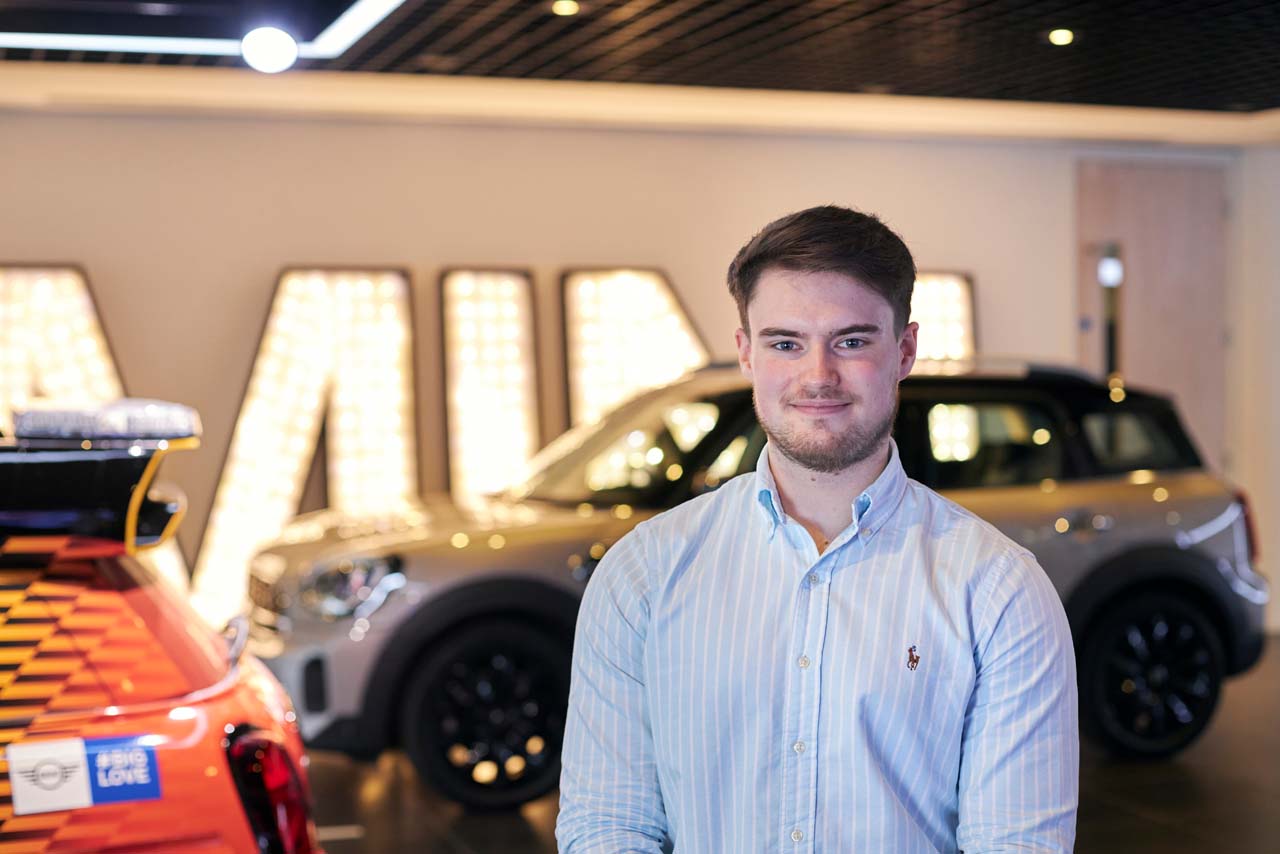 ryan standing in front of a BMW car.