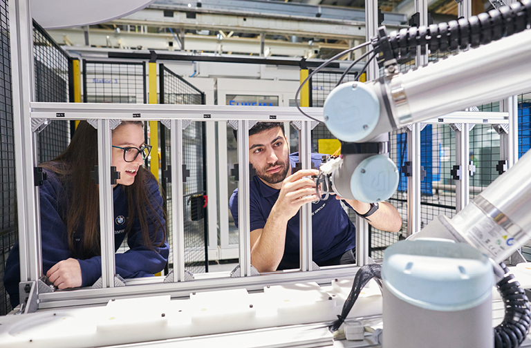 this image shows dominika working with a robot
