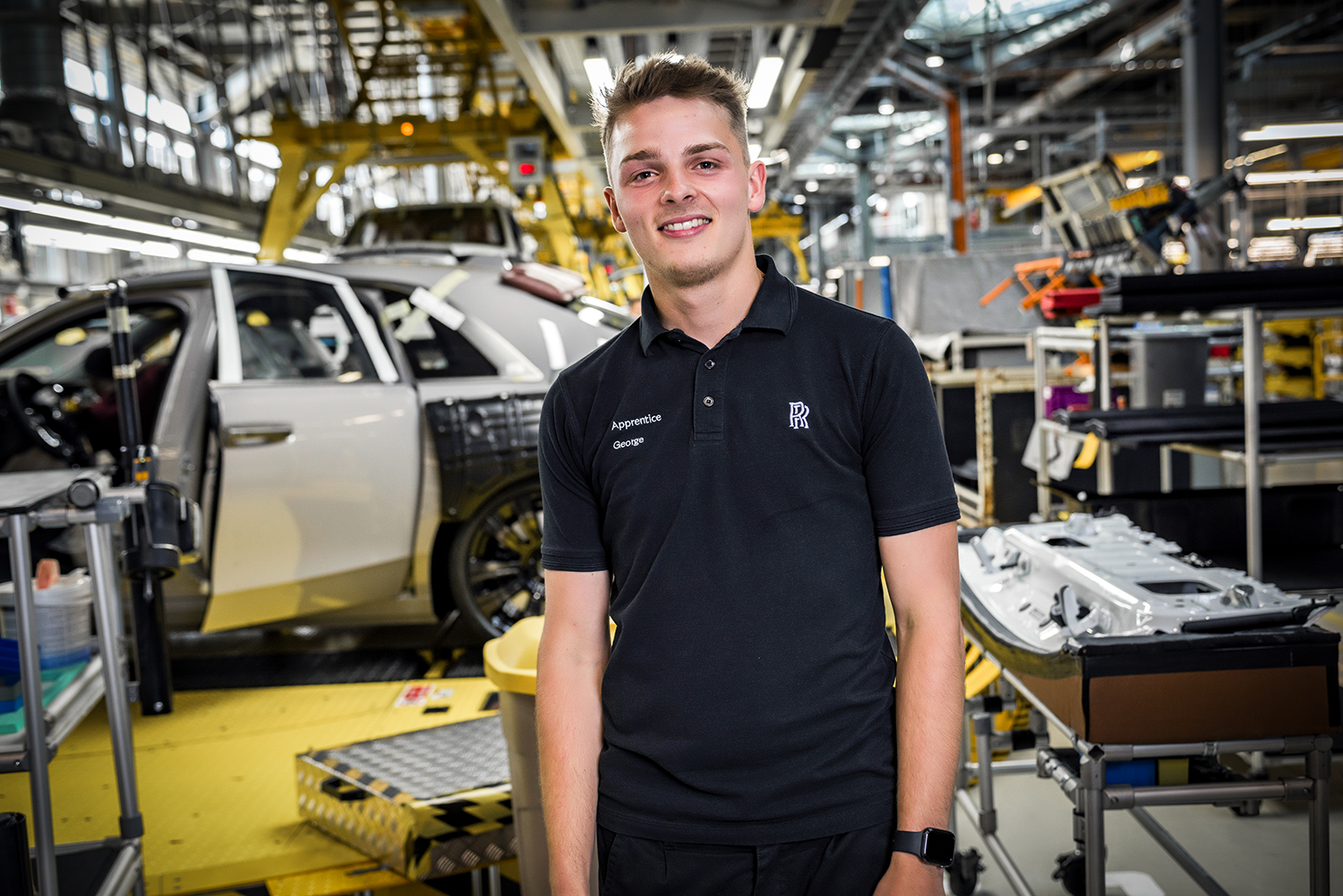 George, BMW Group apprentice standing in the Rolls-Royce production hall