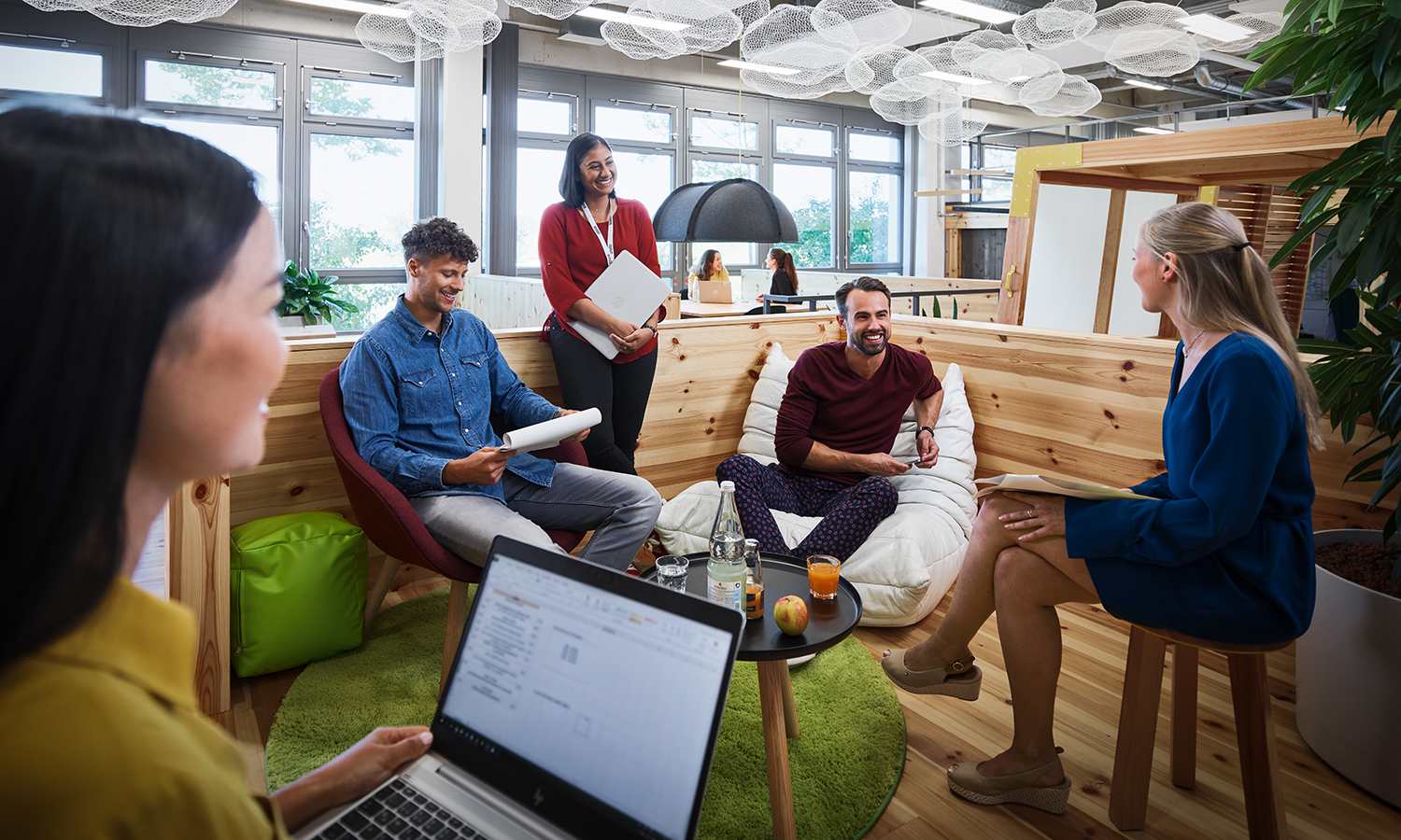 Five Graduate Programme participants having a team meeting.