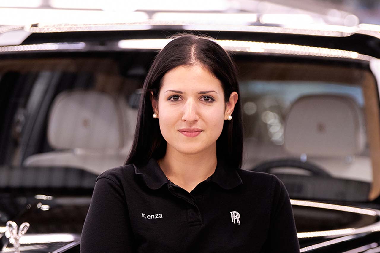 Kenza, a Quality Project Leader smiling at the camera