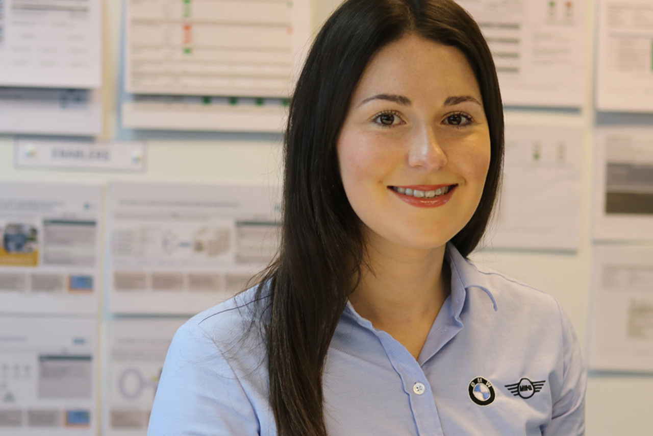 Recent Gradute Rachel at the MINI plant Oxford smiling at the camera