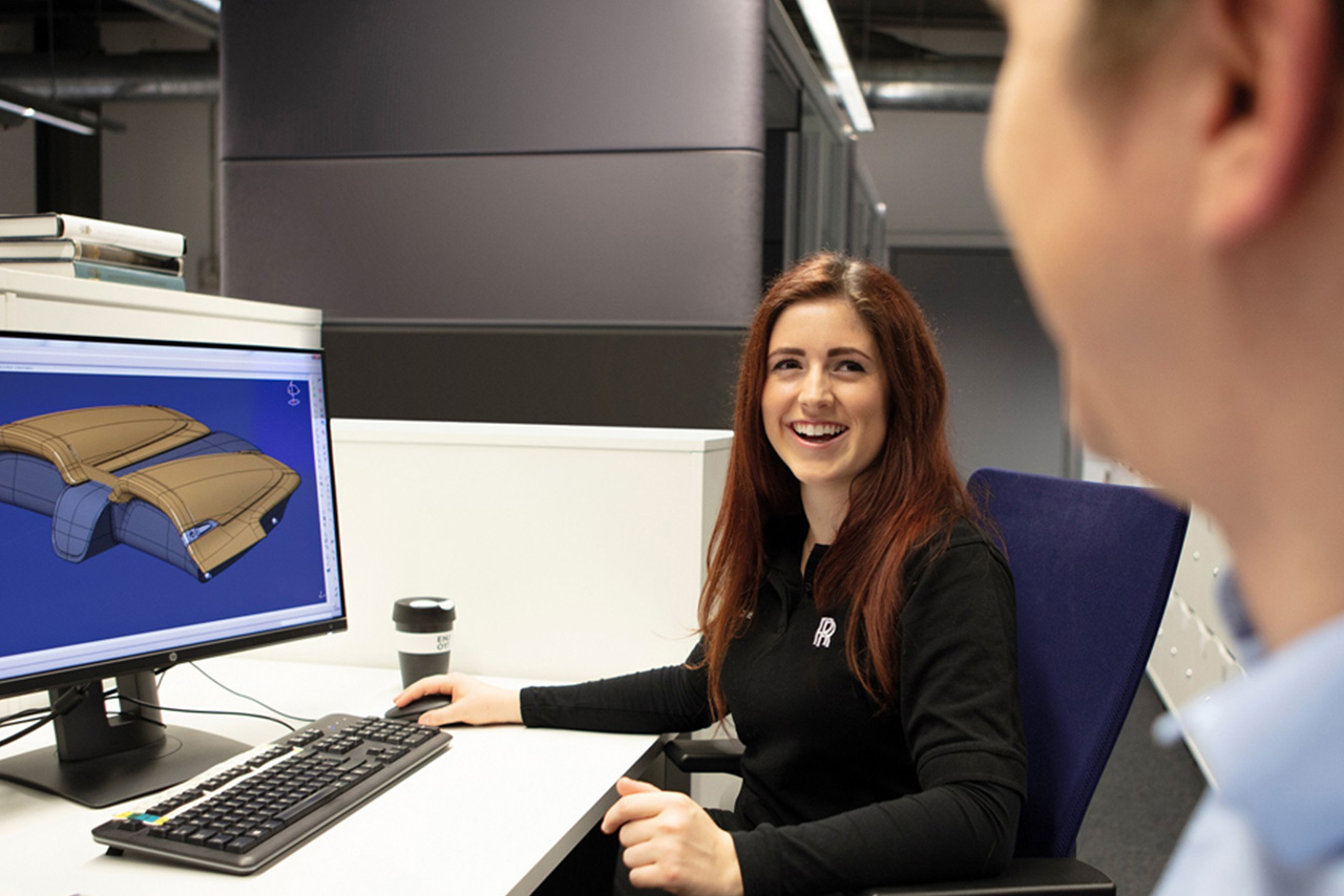 Recent Graduate Sophie working on a computer at Rolls-Royce Motor Cars in Chichester