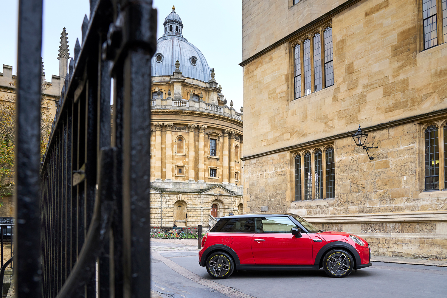 Red MINI standing in front of Radcliffe Camera in Oxford.