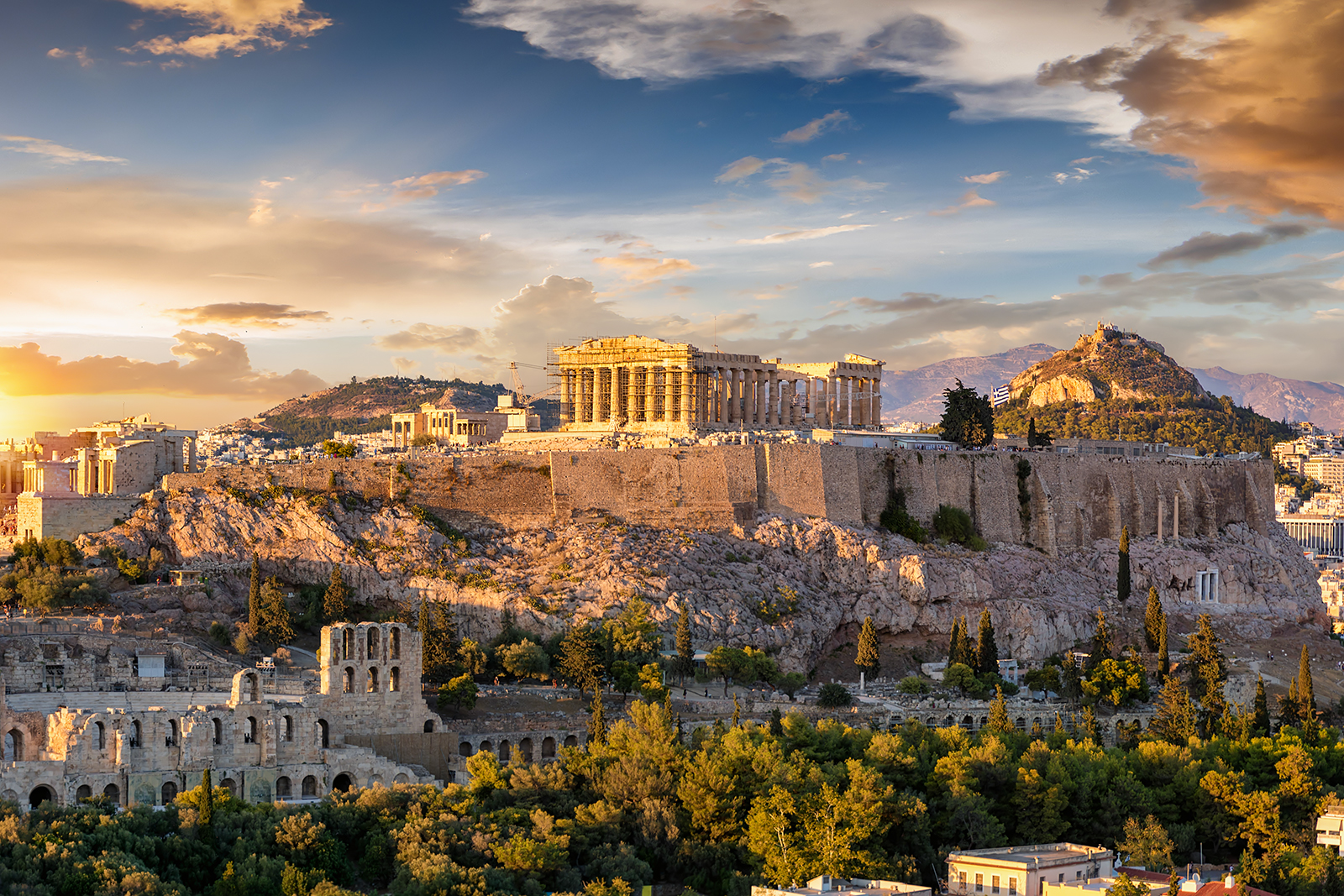 The Acropolis of Athens, Greece, with the Parthenon Temple on top of the hill during a summer sunset