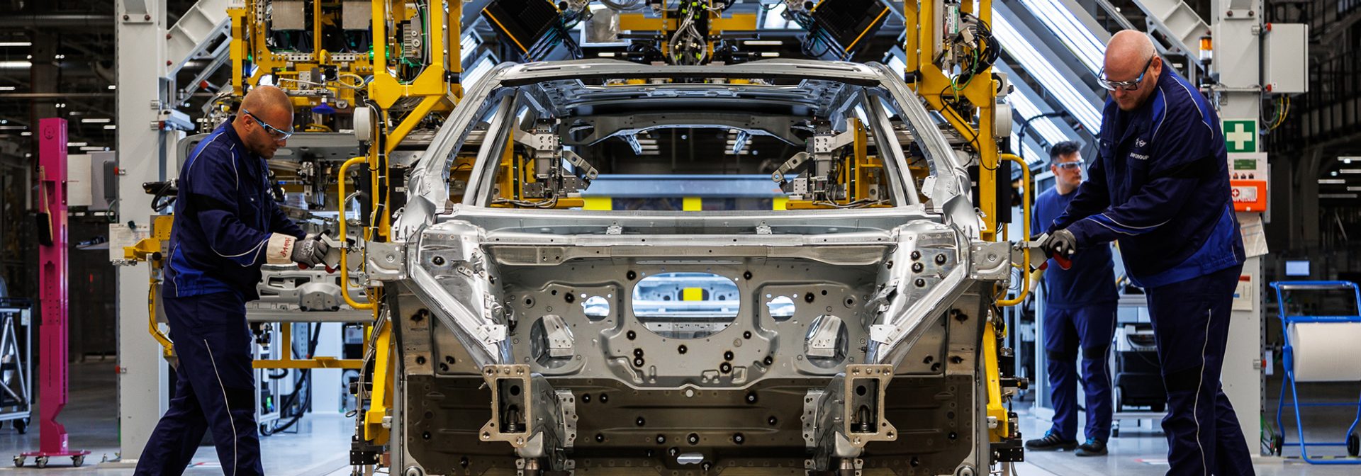 Three workers at the body shop in Plant Debrecen