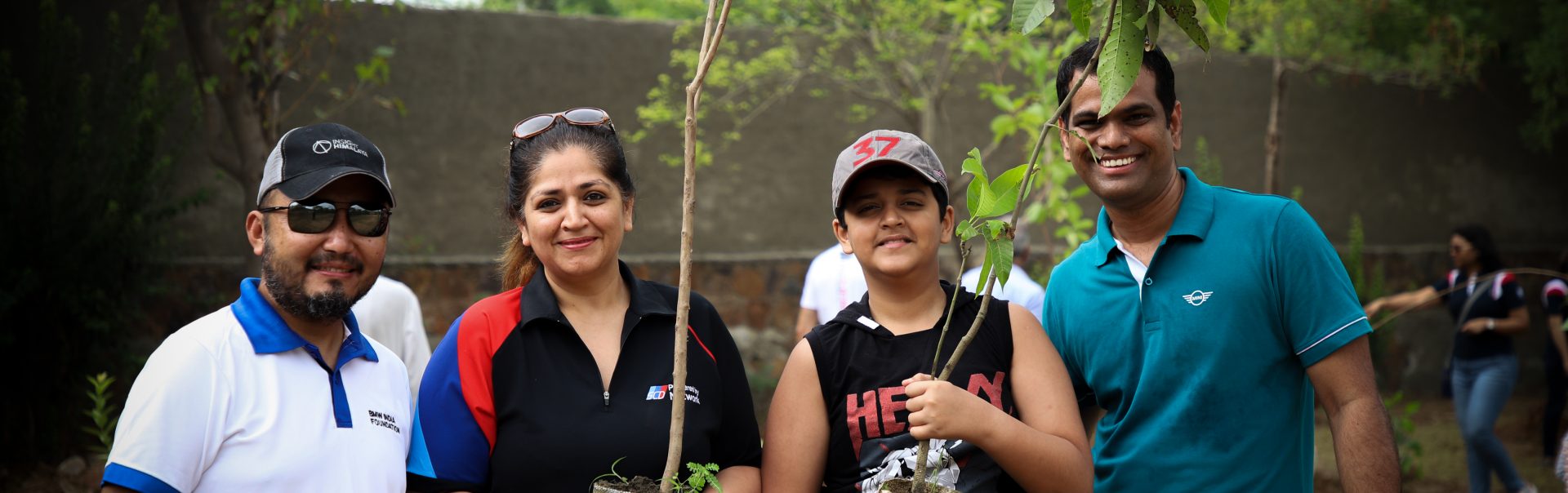 BMW Group employees planting trees.