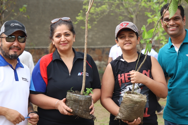 BMW Group employees planting trees.