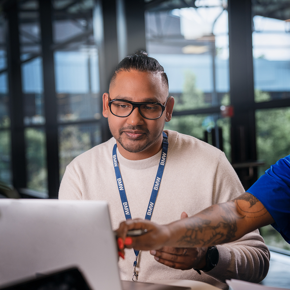 A group of BMW professionals in human resources are having a meeting.