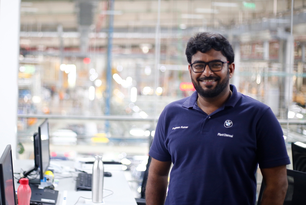 Man smiling at his workplace.