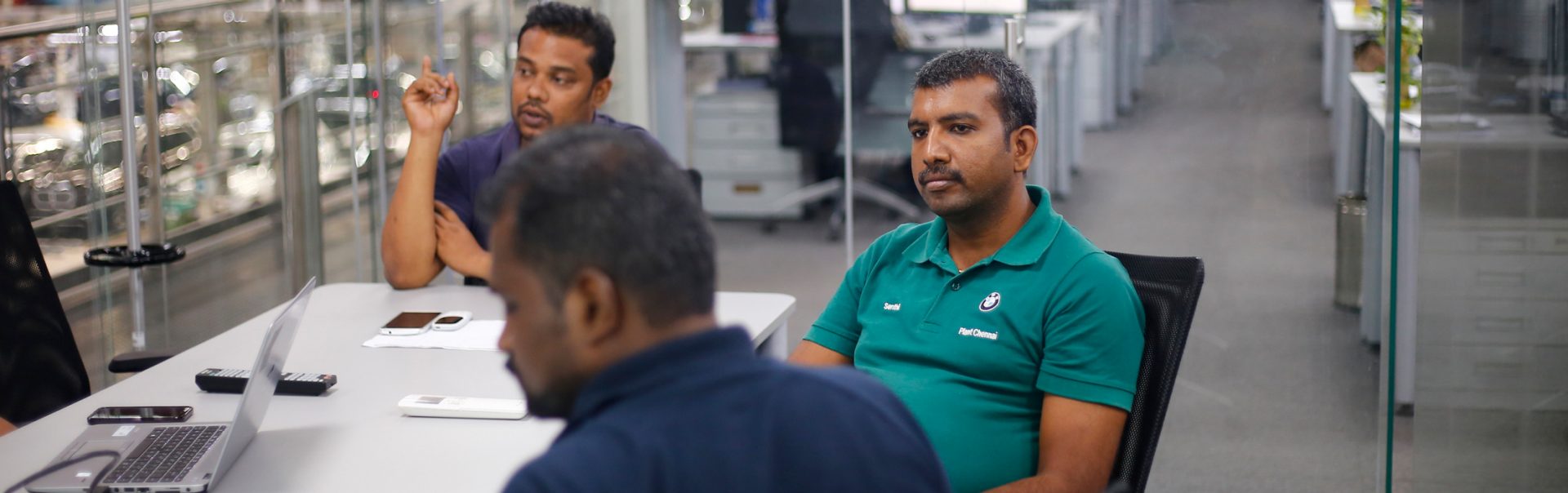 The picture shows a team meeting in the chennai production plant.