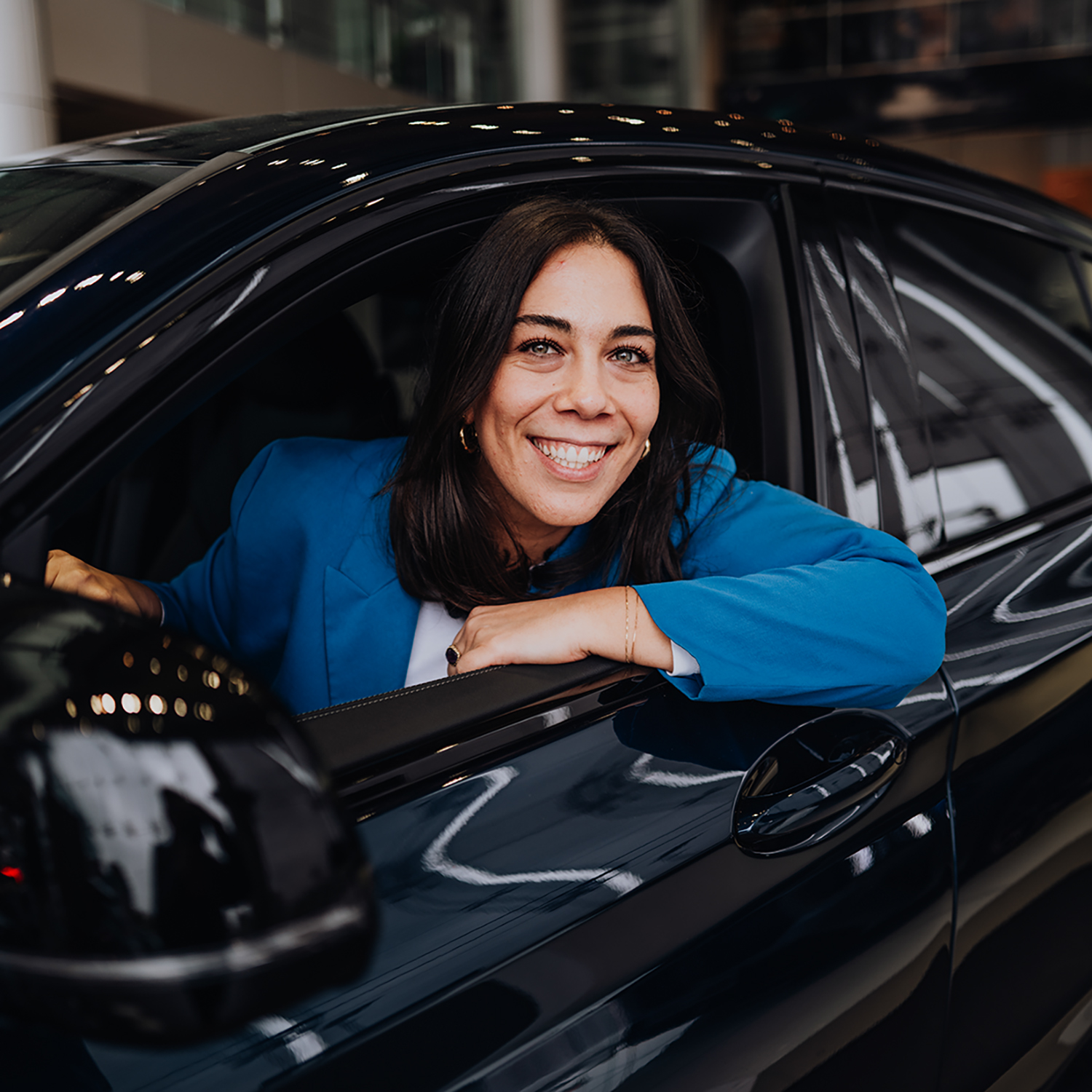 BMW Group employee Camilla sitting in a car