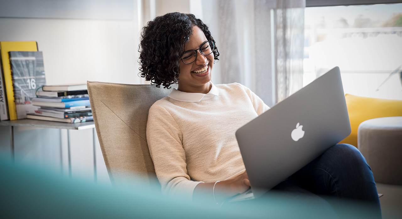 The picture shows a BMW employee joining an online meeting.