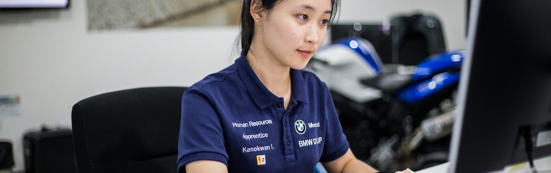 Apprentice working on computer