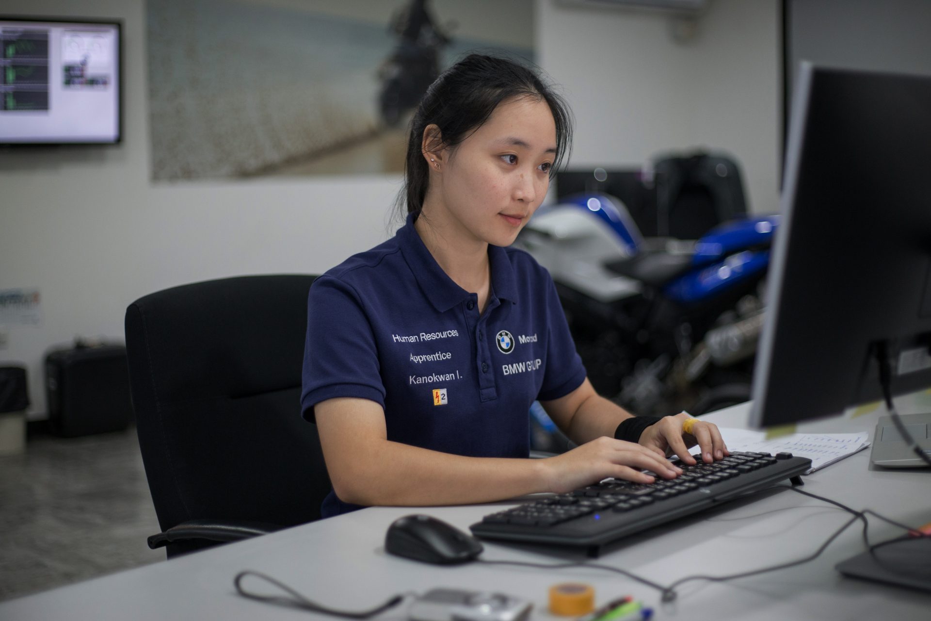 Apprentice working on computer