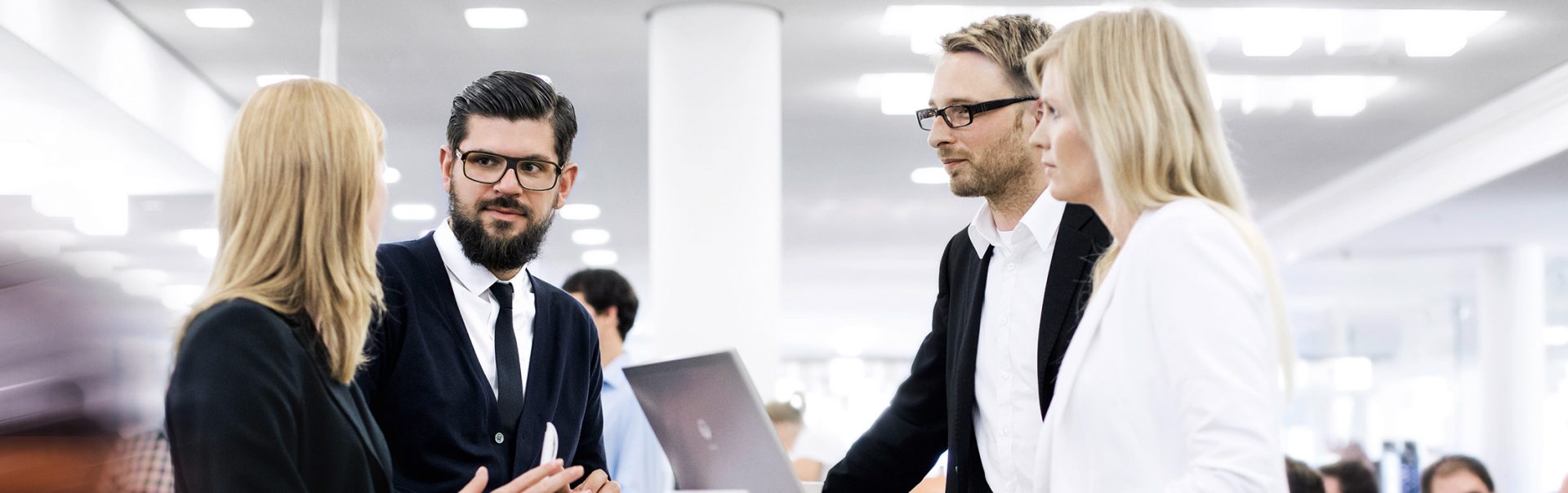 Four colleagues having a conversation together