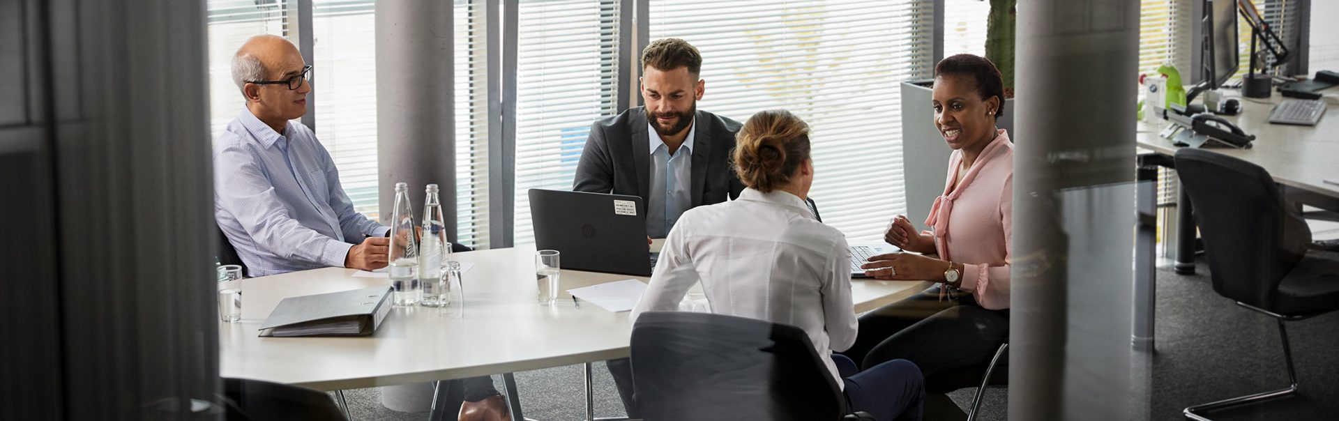 A group of four legal colleagues in a meeting