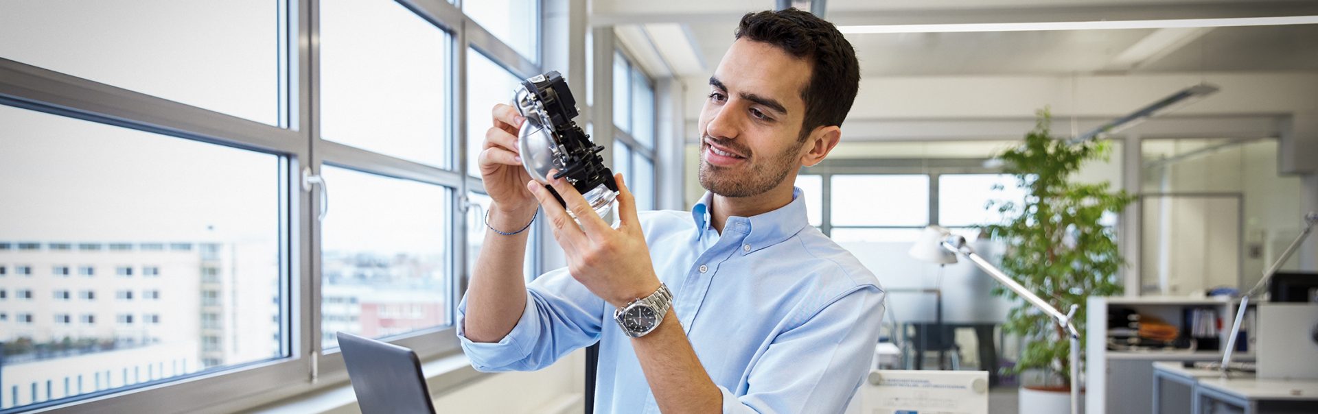 A buyer analyzes a purchased vehicle part.