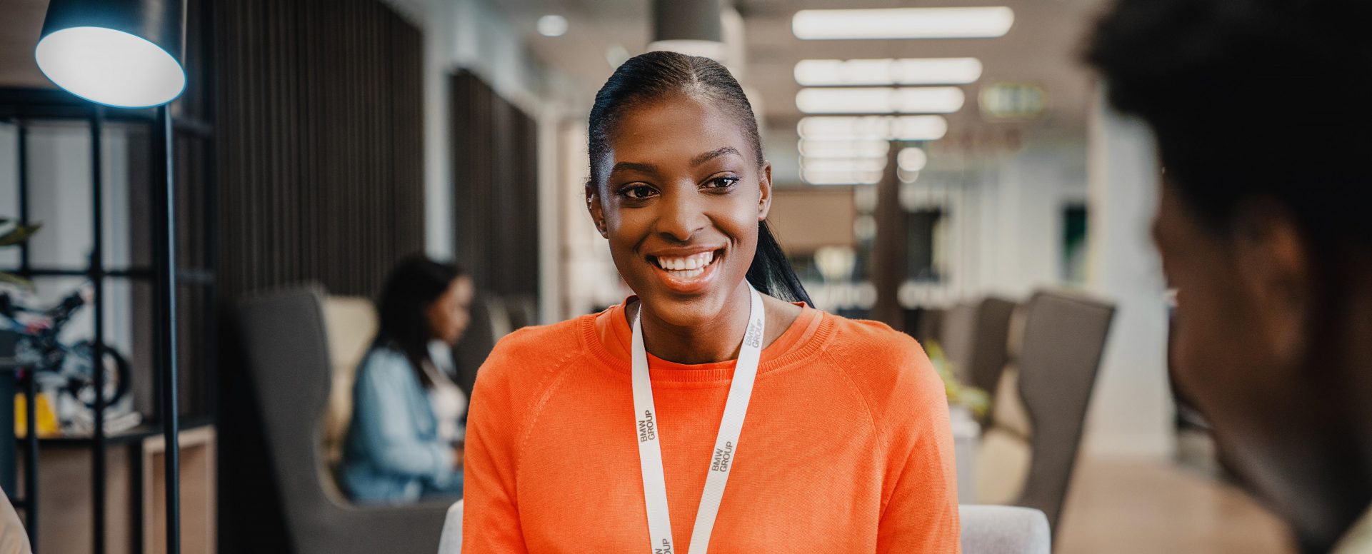 A female student works on a laptop and gains work experience at BMW.