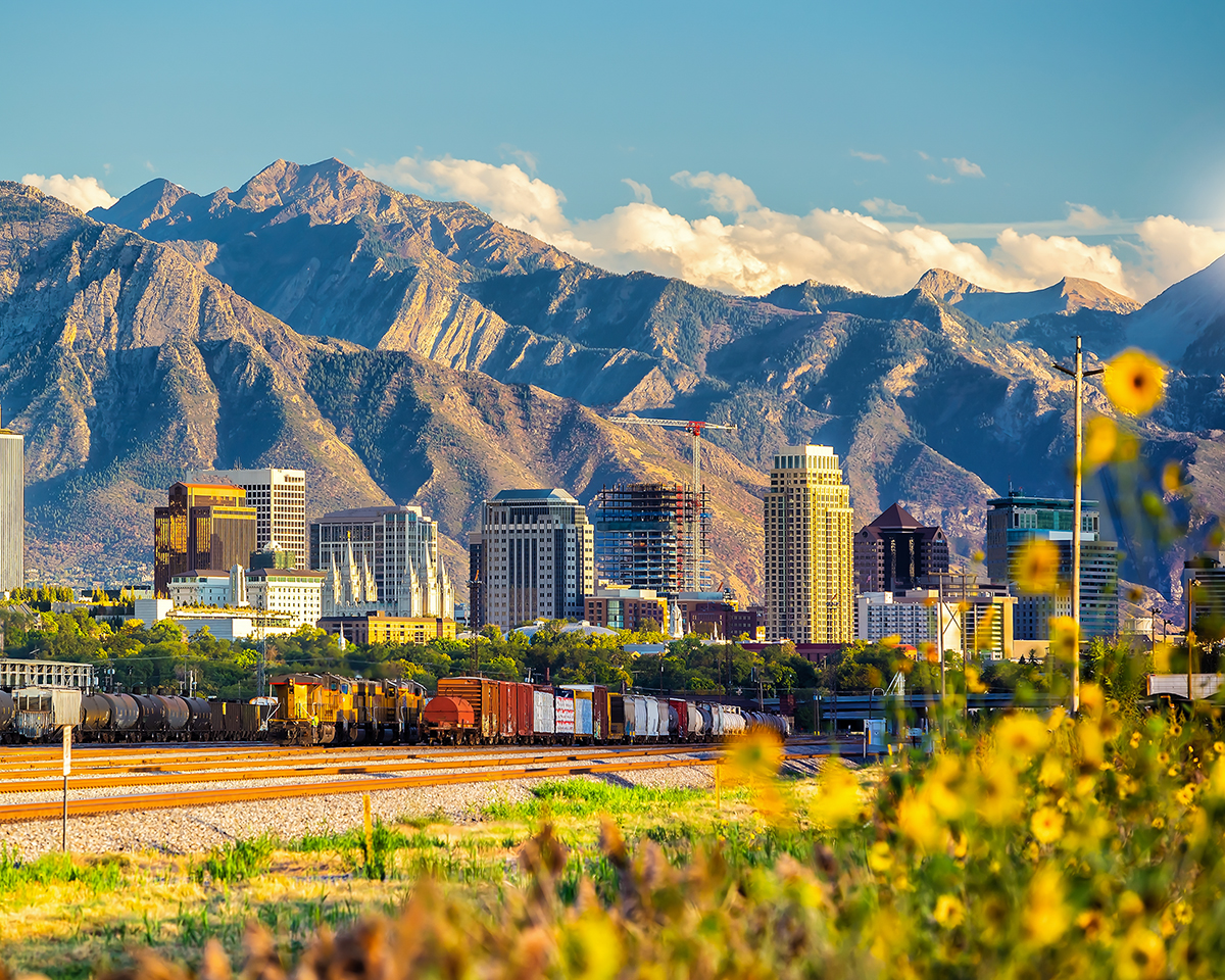 The picture shows Salt Lake City against a backdrop of snow-capped mountains.