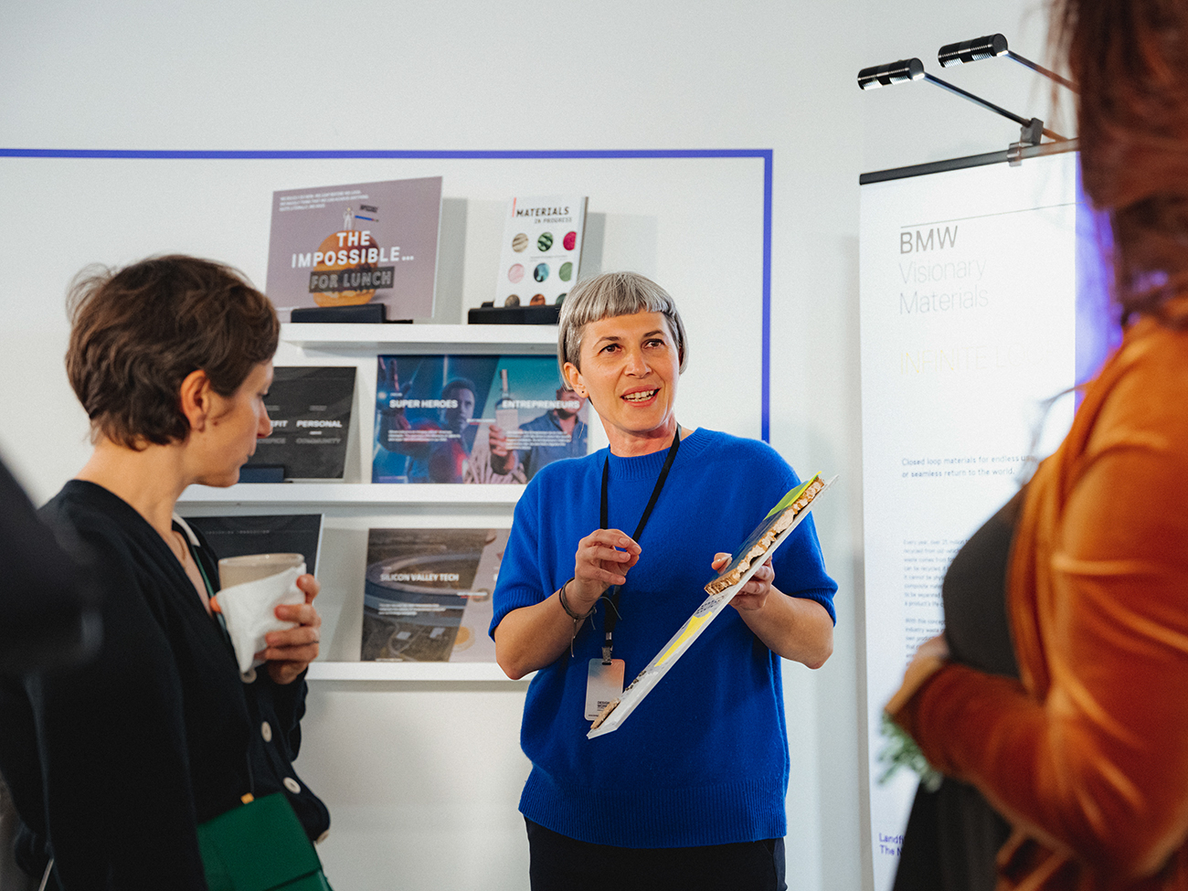 Designworks employees having a conversation.