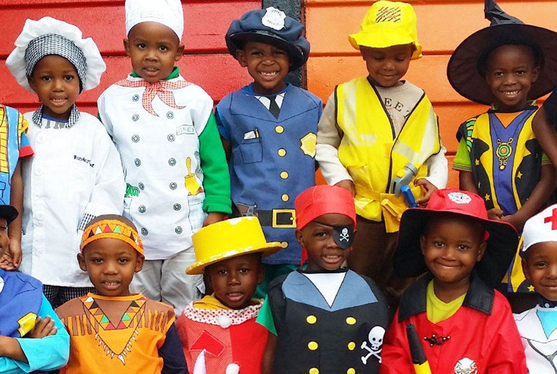 A group of young children dressed in various costumes